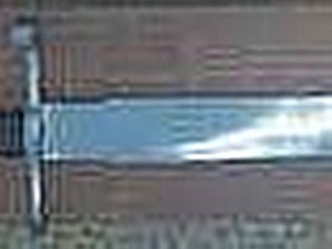 Blurred image of a sword on display.
