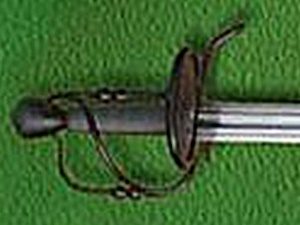Sword hilt on green background.