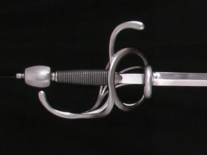 Ornate rapier sword on dark background.