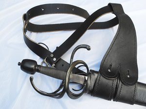 Sword with black leather scabbard and belt.