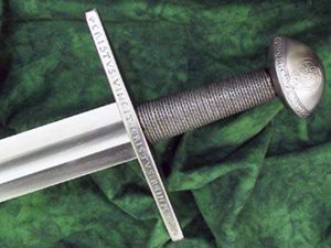 Medieval sword with engraved hilt on cloth.