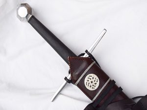 Medieval sword with detailed leather sheath.