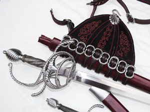 Sword with ornate scabbard and belt.