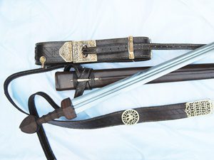 Sword with ornate belt and scabbard.