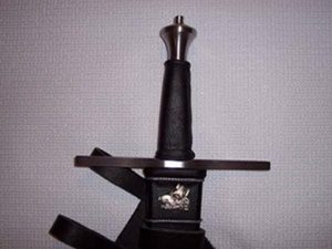 Medieval sword hilt with engraved detail.
