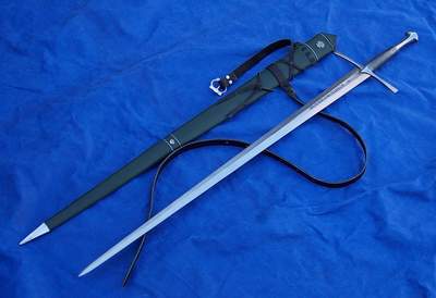 A long sword with a sheath and strap on a blue fabric background.