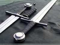 Two medieval-style longswords with leather-wrapped hilts.