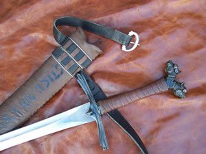 Medieval sword with leather scabbard and belt