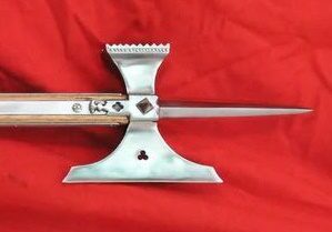 Decorative polearm weapon on red background.