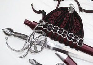 Sword with ornate scabbard and belt.