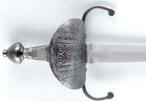 Ornate sword with decorative hilt design.